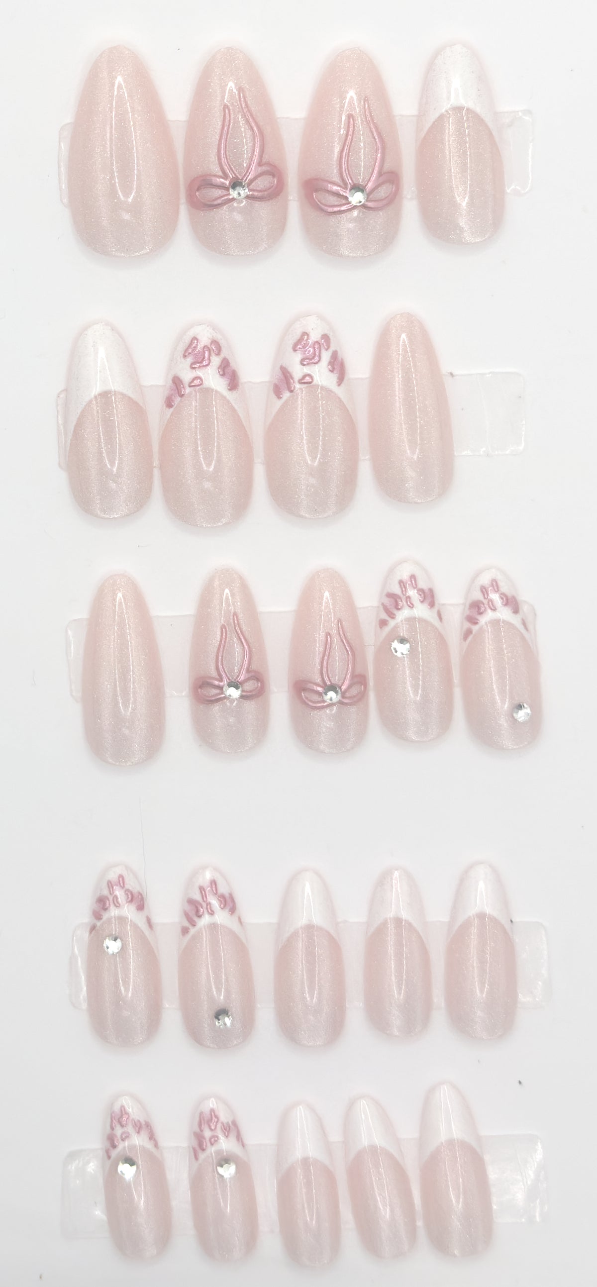 Full ribbon blush almond set laid out in three rows from largest to smallest size