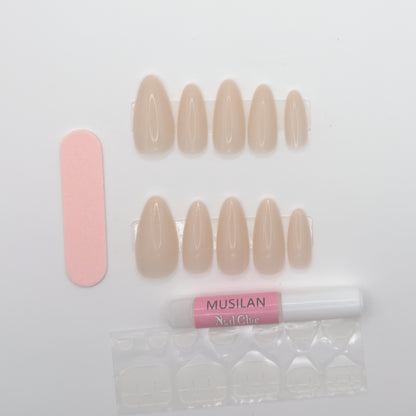 Set of nude-colored false nails with a pink nail file and nail glue on a white background