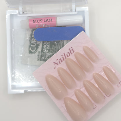 Cashmere nude set on its card beside the open kit with nail glue, nail file, and prep pad