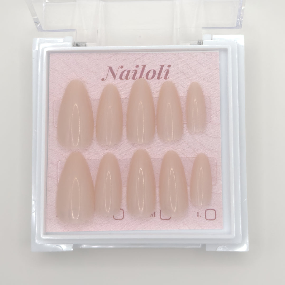 Set of beige false nails in a 'Nailoli' packaging on a light background