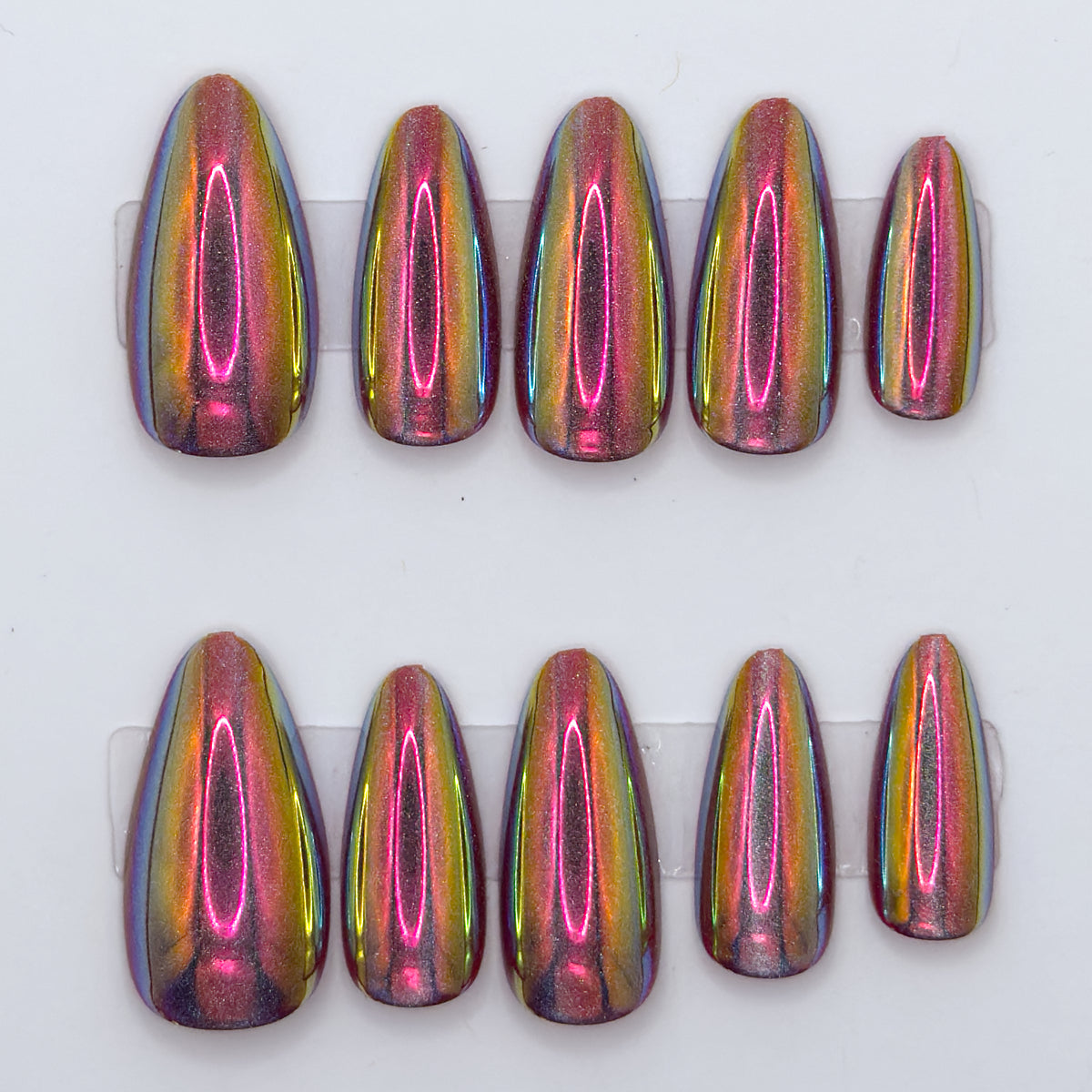 Set of eight multicolored nail extensions on a white background