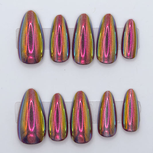 Set of eight multicolored nail extensions on a white background