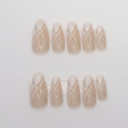Set of beige nail art designs with white lines on a light gray background