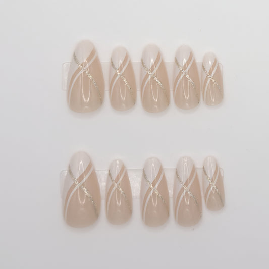 Set of beige nail art designs with white lines on a light gray background