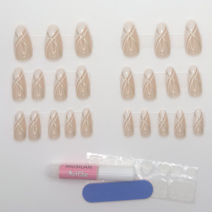 Set of beige nail extensions with a bottle of nail glue on a white background