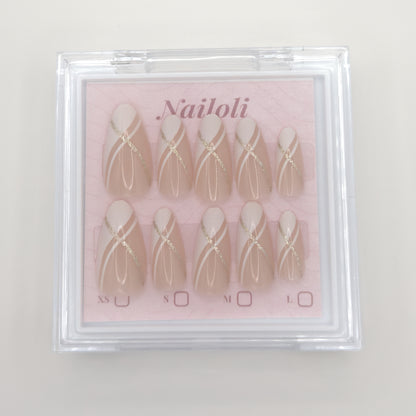 Champagne round set with gold line art inside the closed clear Nailoli case