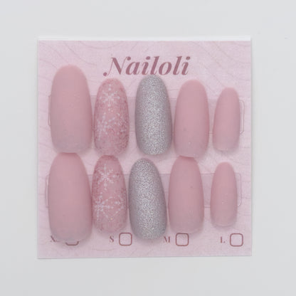 Set of pink and silver nails on a 'Nailoli' branded card.