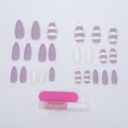 Set of purple and white striped nail art stickers with a pink tool on a light gray background