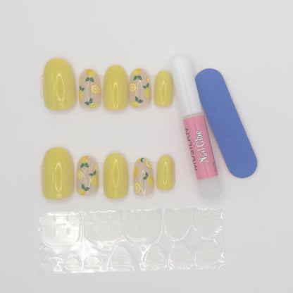 Set of yellow nail art designs with a nail file and polish bottle on a white background