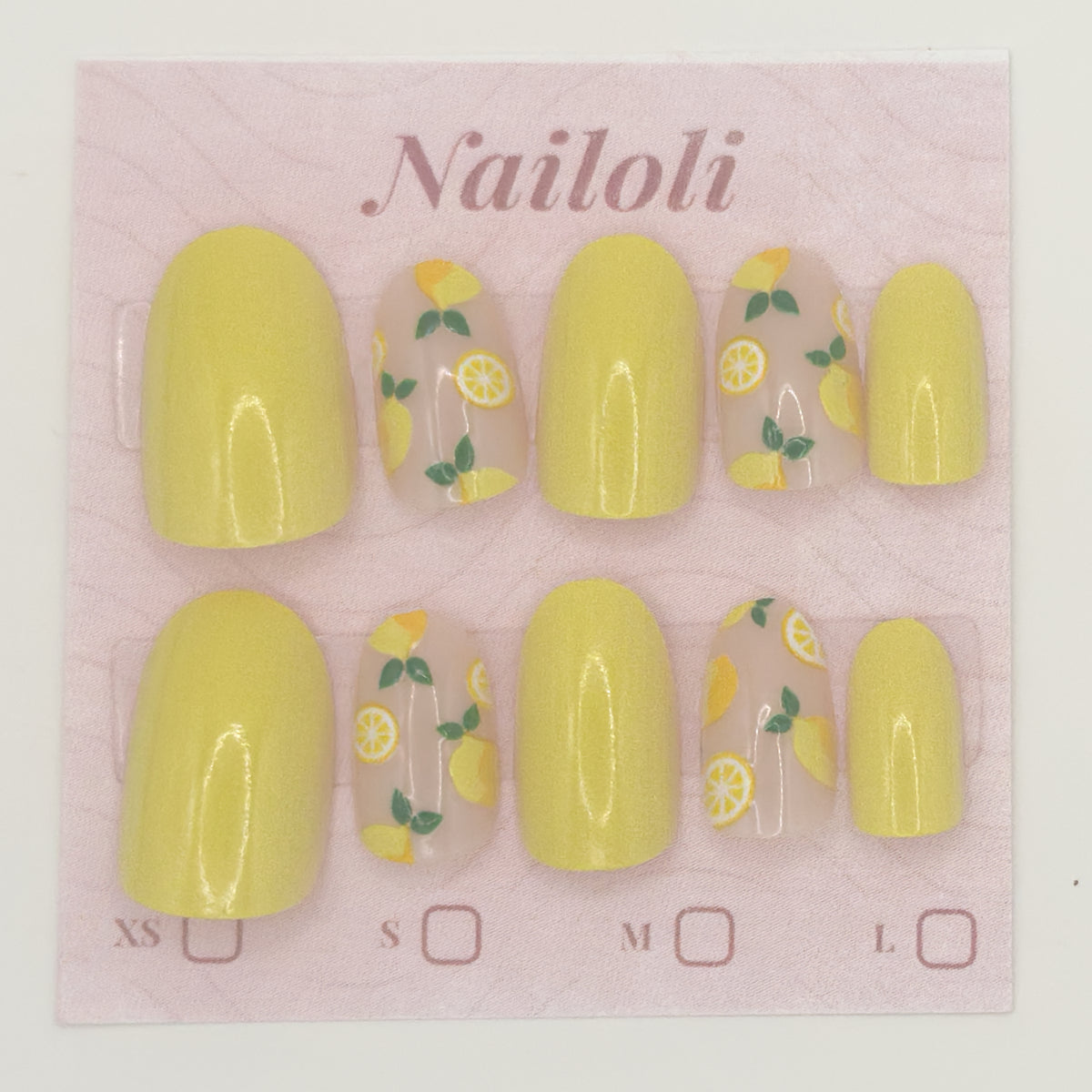 Yellow nail polish set with lemon design on a pink 'Nailoli' branded card.