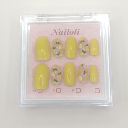 Lemon slice nails on the pink Nailoli backing card inside the closed clear case