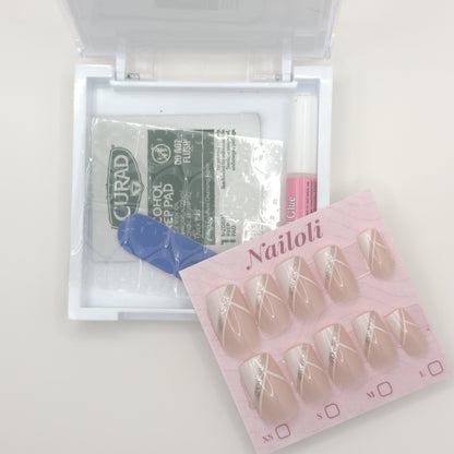 Packaged false nails with a Curad bandage and blue tool on a white background