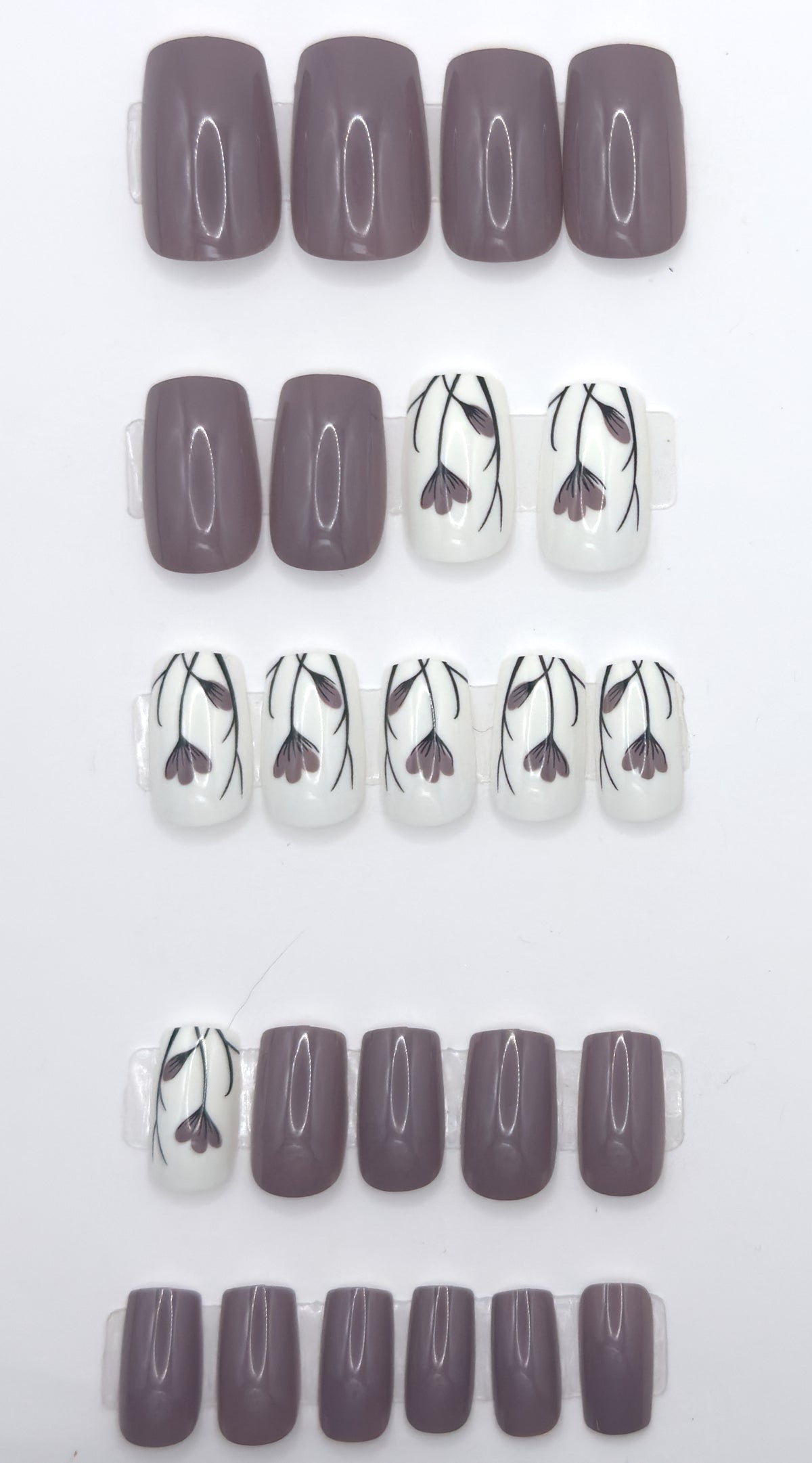Full taupe floral set laid out in rows from largest to smallest size
