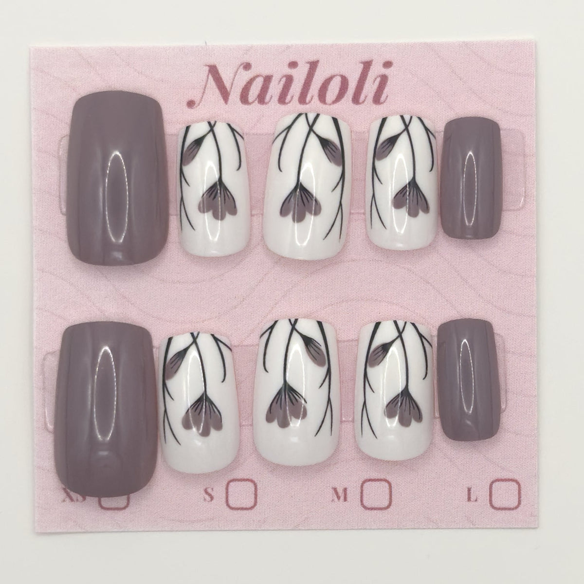 Taupe floral nails on the pink Nailoli backing card