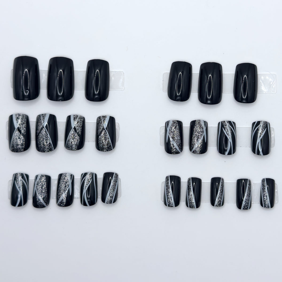 Full glossy black set laid out in rows from largest to smallest size