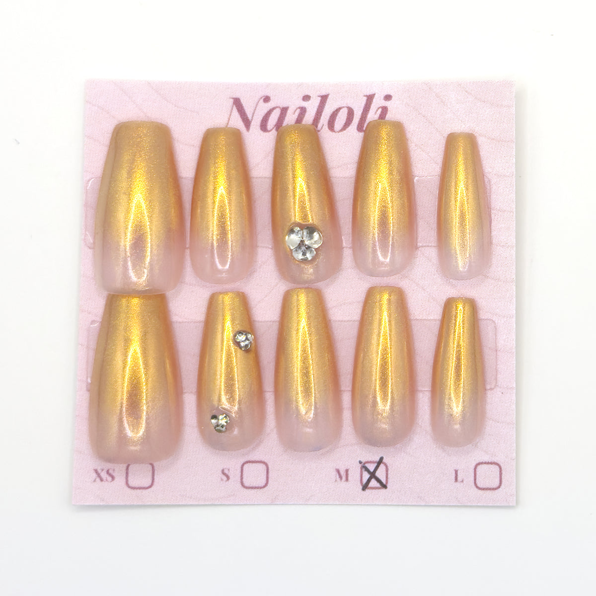 Champagne gold coffin nails on the Nailoli backing card with size M marked