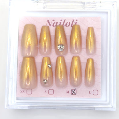 Champagne gold set on its backing card inside the open clear Nailoli case