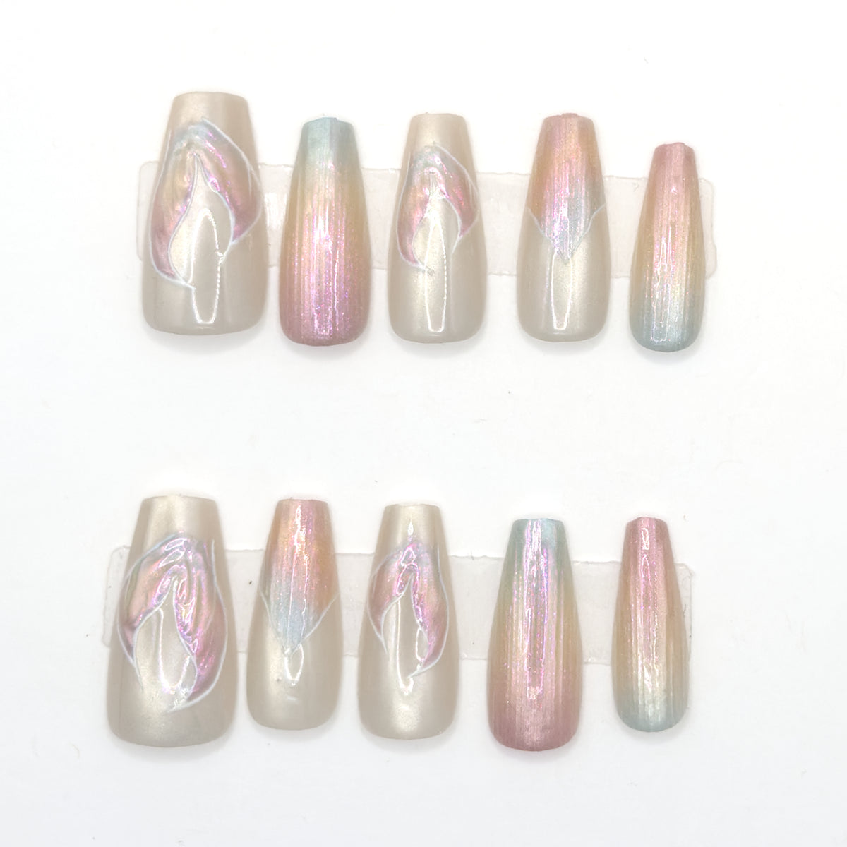 10 long pearl aurora coffin press-ons in two rows with iridescent streaks and petal line art