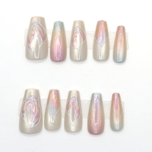 10 long pearl aurora coffin press-ons in two rows with iridescent streaks and petal line art