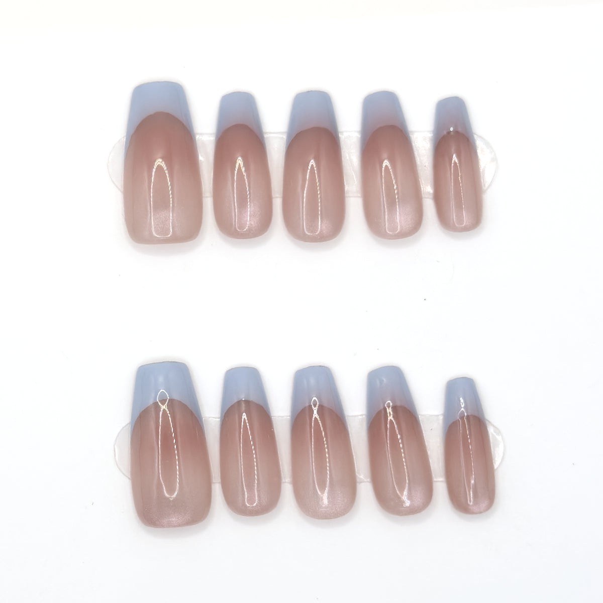10 sheer blush coffin press-ons in two rows with powder blue French tips