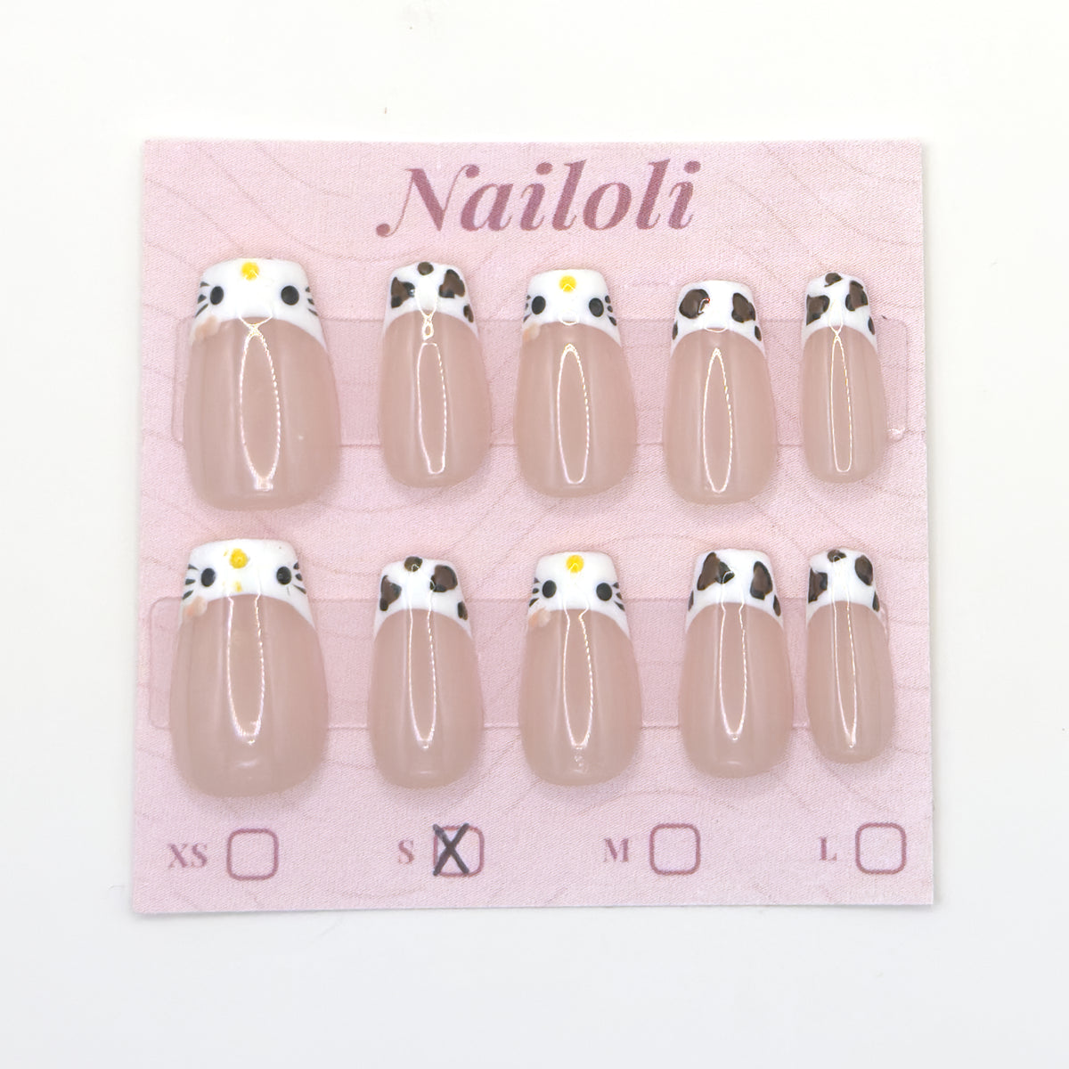Cat and cowprint nails on the Nailoli backing card with size S marked