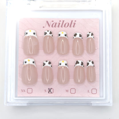 Cat and cowprint set on its backing card inside the open clear Nailoli case