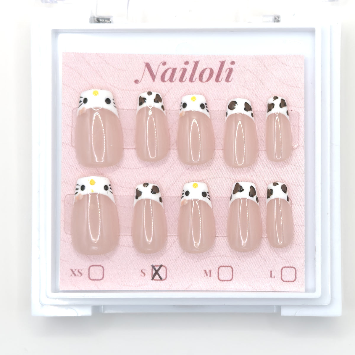 Cat and cowprint set inside the closed clear Nailoli case
