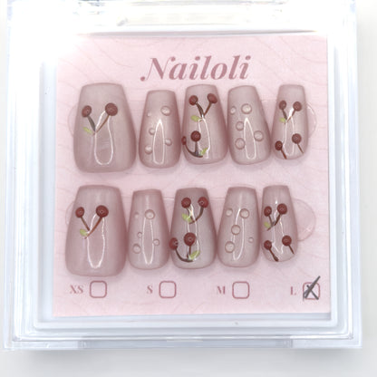 Cherry blush set on its backing card in the clear Nailoli case