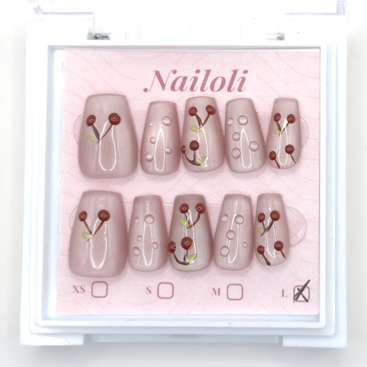Cherry blush set in the closed clear Nailoli case, viewed from above