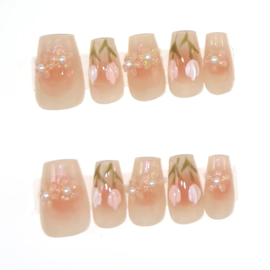 Ten short coffin press-ons in sheer peach with white and pink 3D tulips and beaded pearl flowers