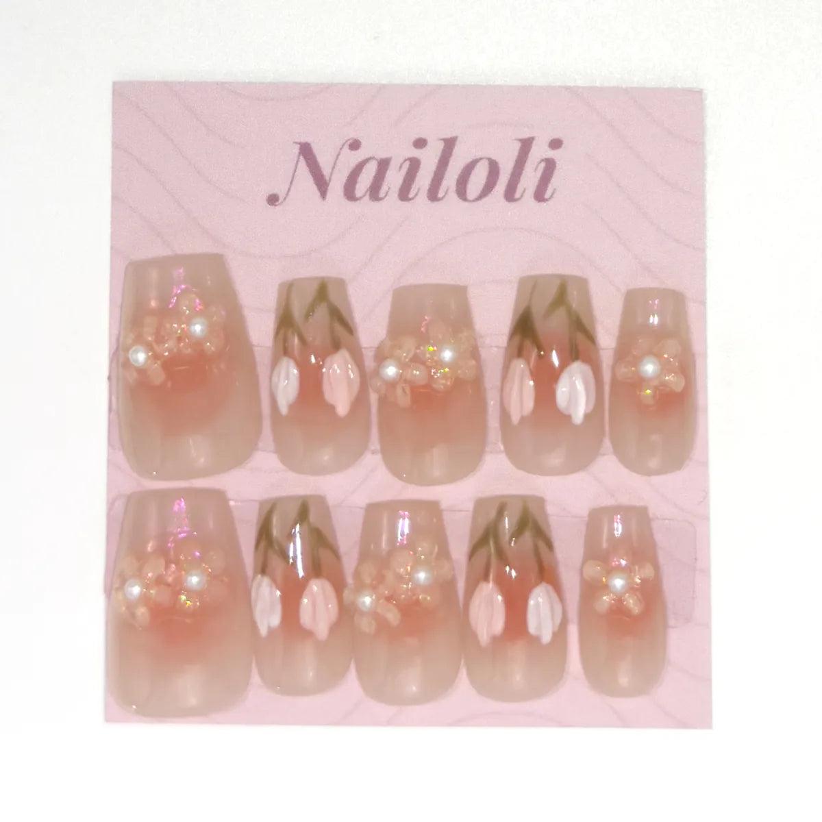 Sheer peach coffin set on the pink Nailoli backing card