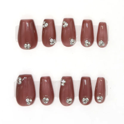 Ten short coffin press-ons in antique rose with clusters of clear gemstones