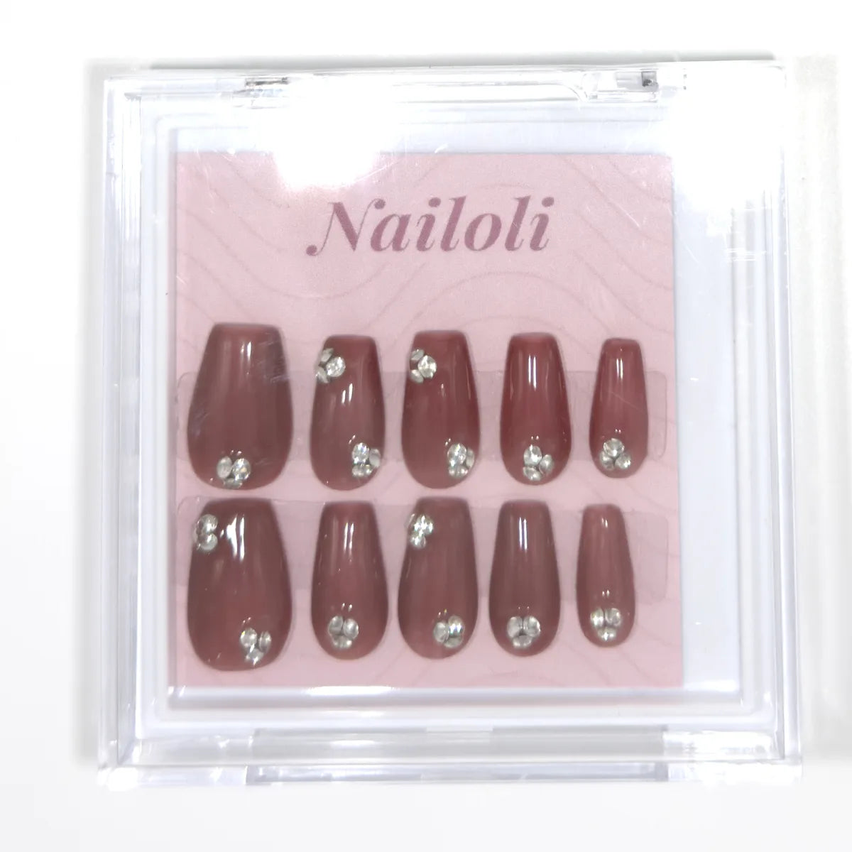 Antique rose coffin set inside the closed clear Nailoli case