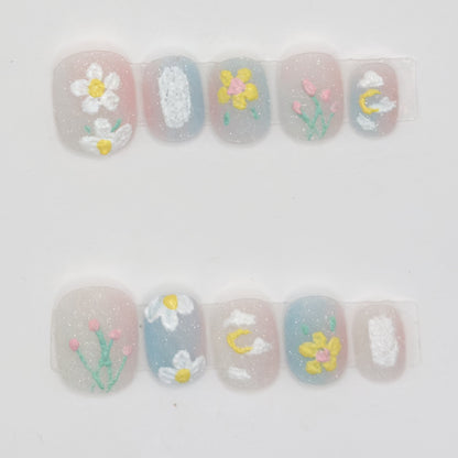 10 milky sheer press-ons in two rows with white daisies, pink tulips, a yellow flower, and a moon