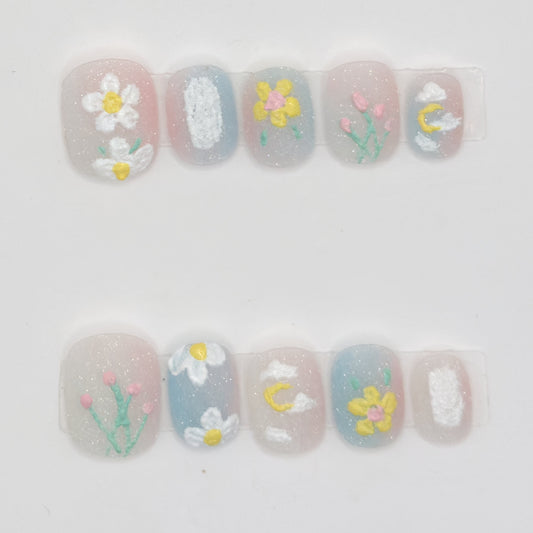 10 milky sheer press-ons in two rows with white daisies, pink tulips, a yellow flower, and a moon