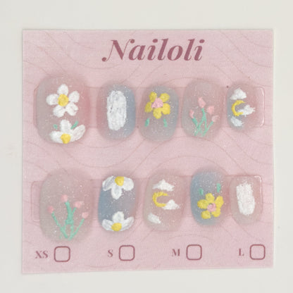 Milky sheer daisy and tulip nails on the pink Nailoli backing card