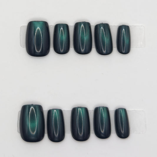10 emerald cat eye square press-ons in two rows showing the green light band on each nail