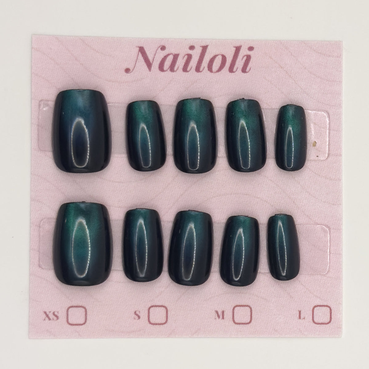 Emerald cat eye nails on the pink Nailoli backing card with XS, S, M, and L size boxes