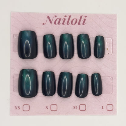 Emerald cat eye nails on the pink Nailoli backing card with XS, S, M, and L size boxes