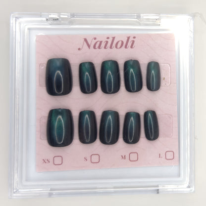 Emerald cat eye set inside the closed clear Nailoli case