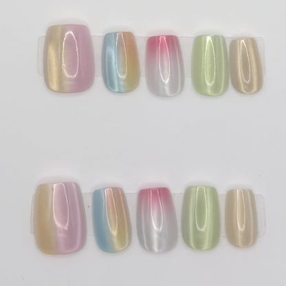 10 pastel chrome square press-ons in two rows, each nail a different ombre chrome shade
