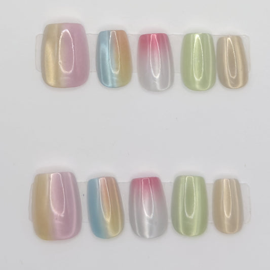 10 pastel chrome square press-ons in two rows, each nail a different ombre chrome shade