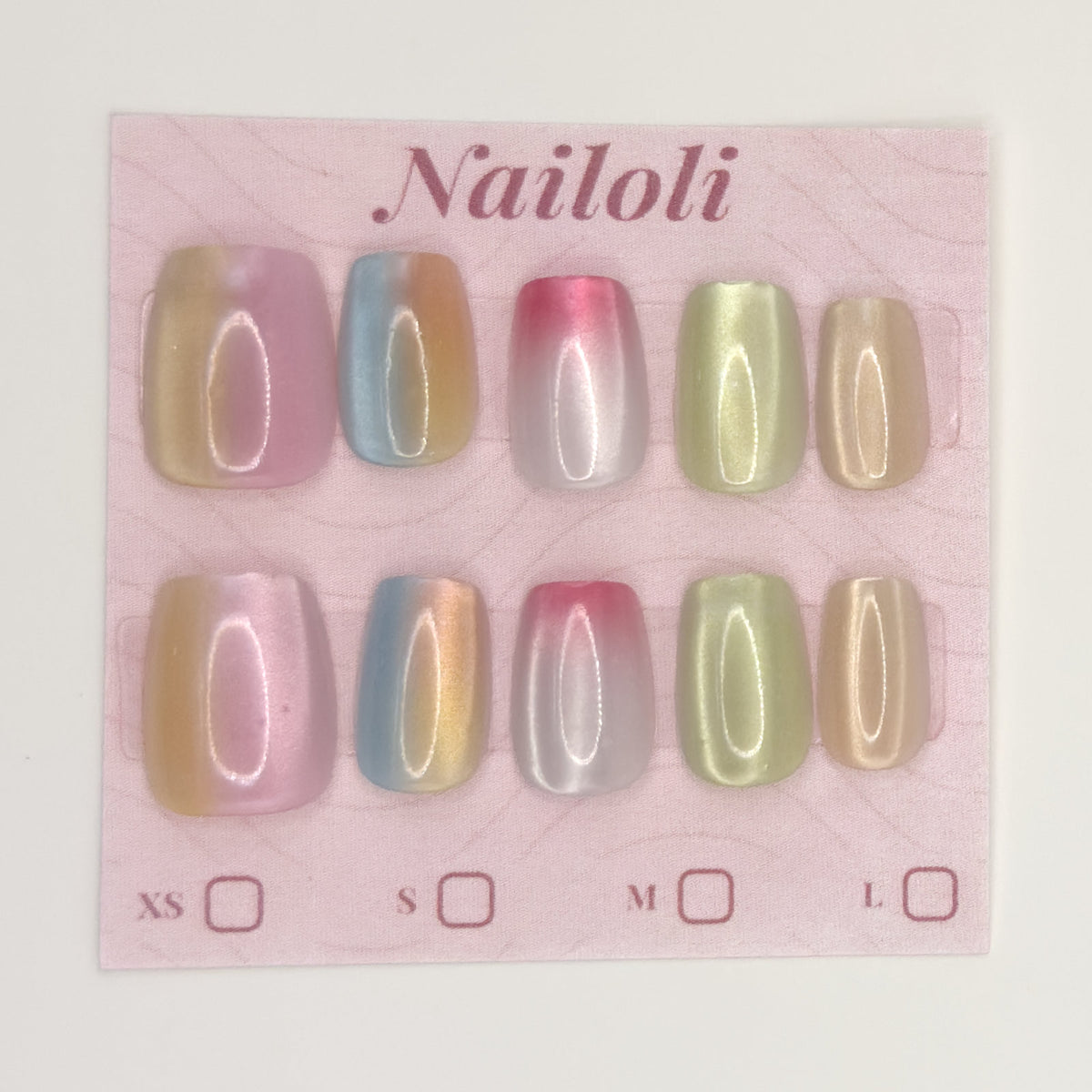Pastel chrome nails on the pink Nailoli backing card