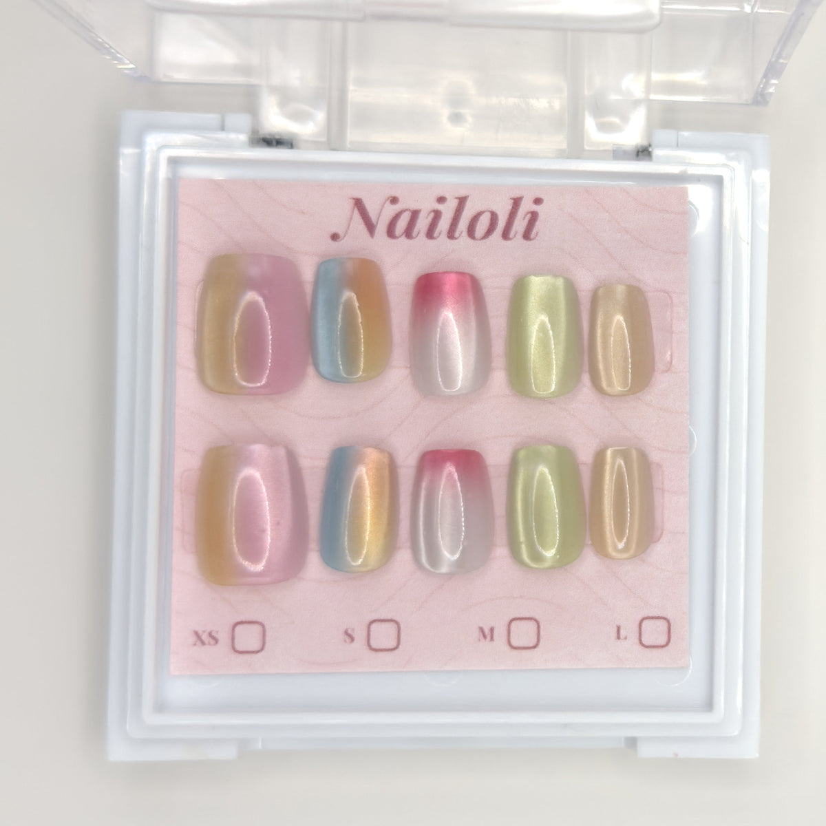 Pastel chrome set on its backing card inside the open clear Nailoli case