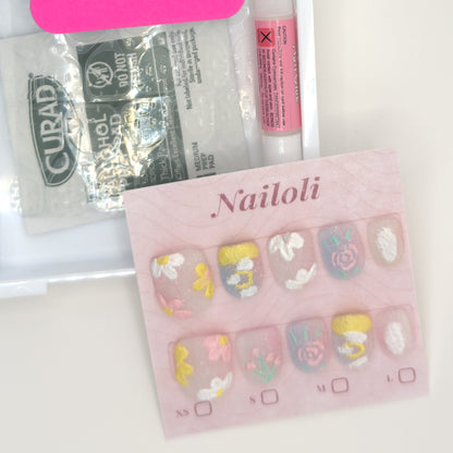 Milky pastel set on its card beside the open kit with nail glue, prep pad, and nail file