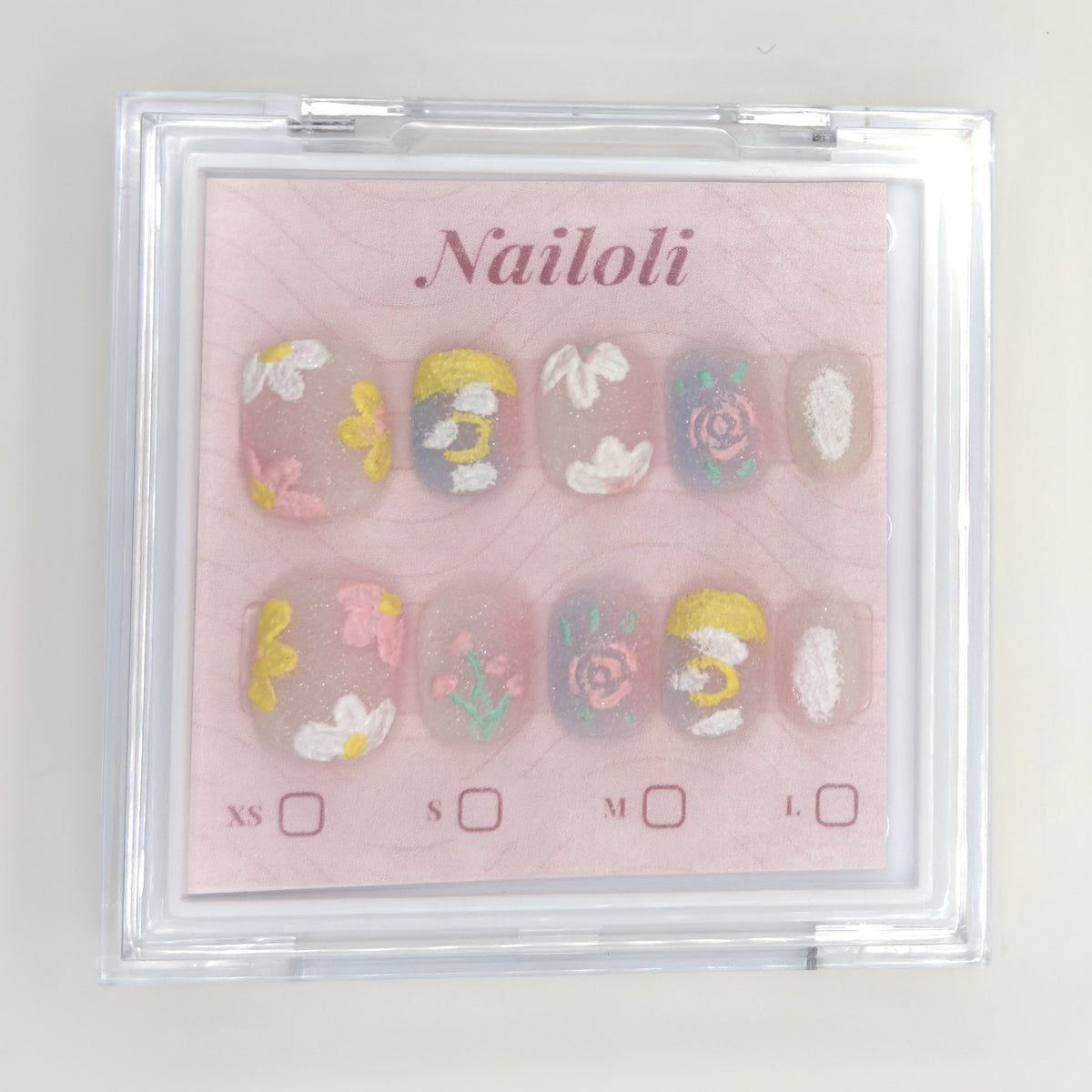 Milky pastel set inside the closed clear Nailoli case