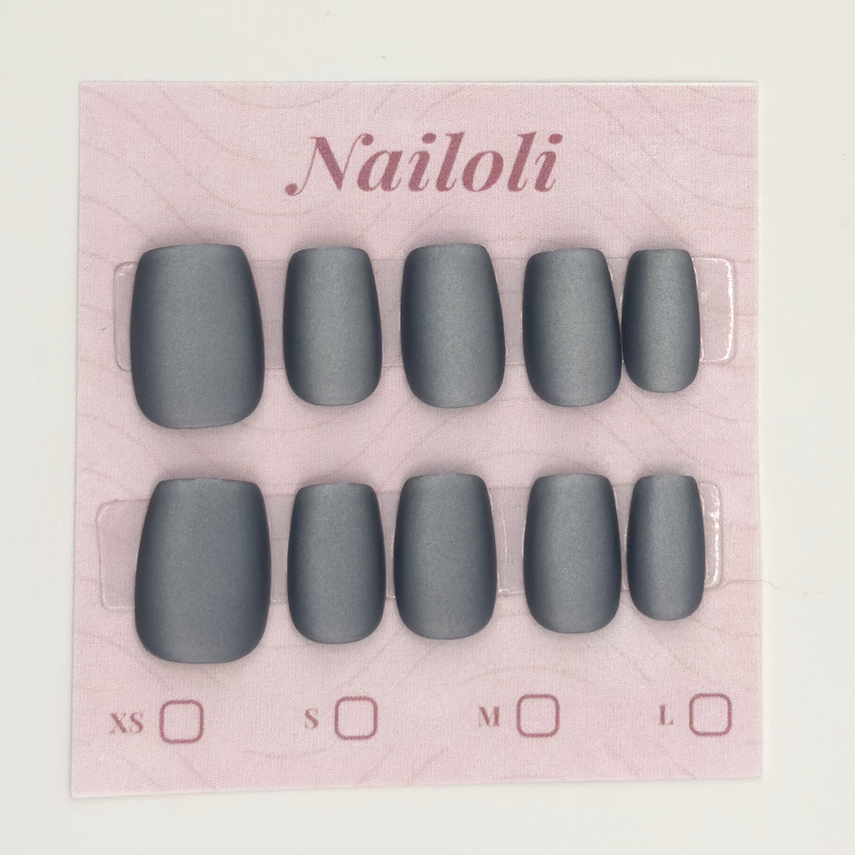 Matte charcoal nails on the pink Nailoli backing card with XS, S, M, and L size boxes