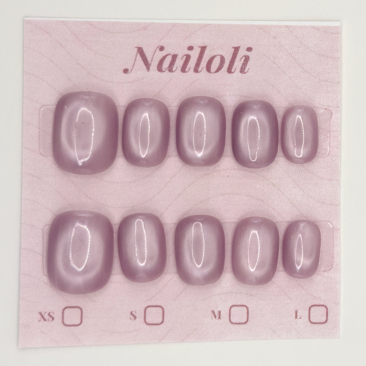 Dusty mauve nails on the pink Nailoli backing card with XS, S, M, and L size boxes
