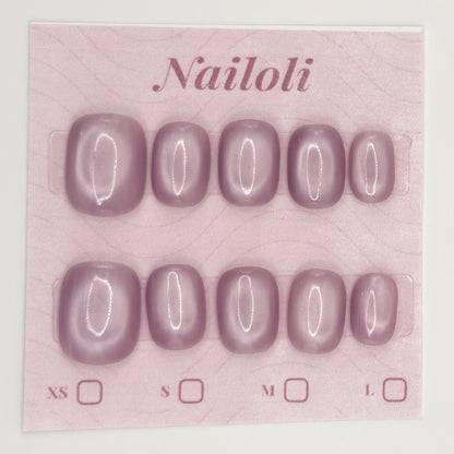 Dusty mauve nails on the pink Nailoli backing card with XS, S, M, and L size boxes