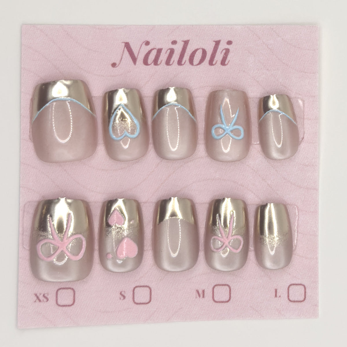 Champagne chrome nails on the pink Nailoli backing card with XS, S, M, and L size boxes